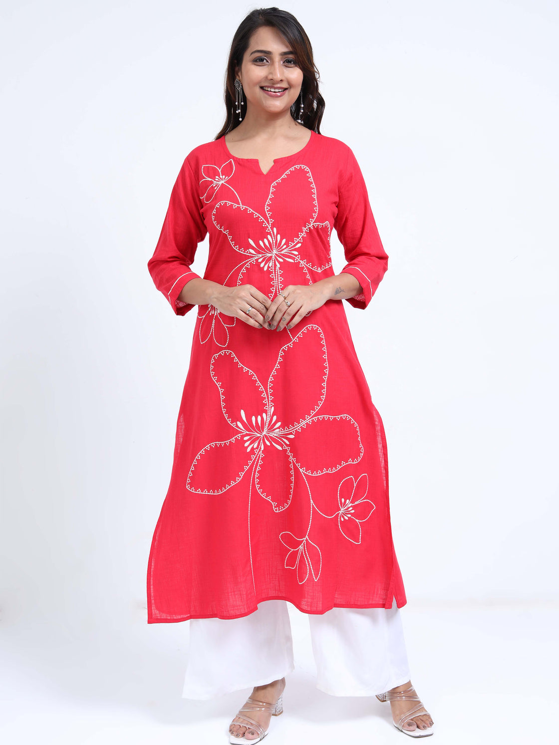 Straight-cut midi kurti with floral embroidery and 3/4 sleeves, paired with palazzos.