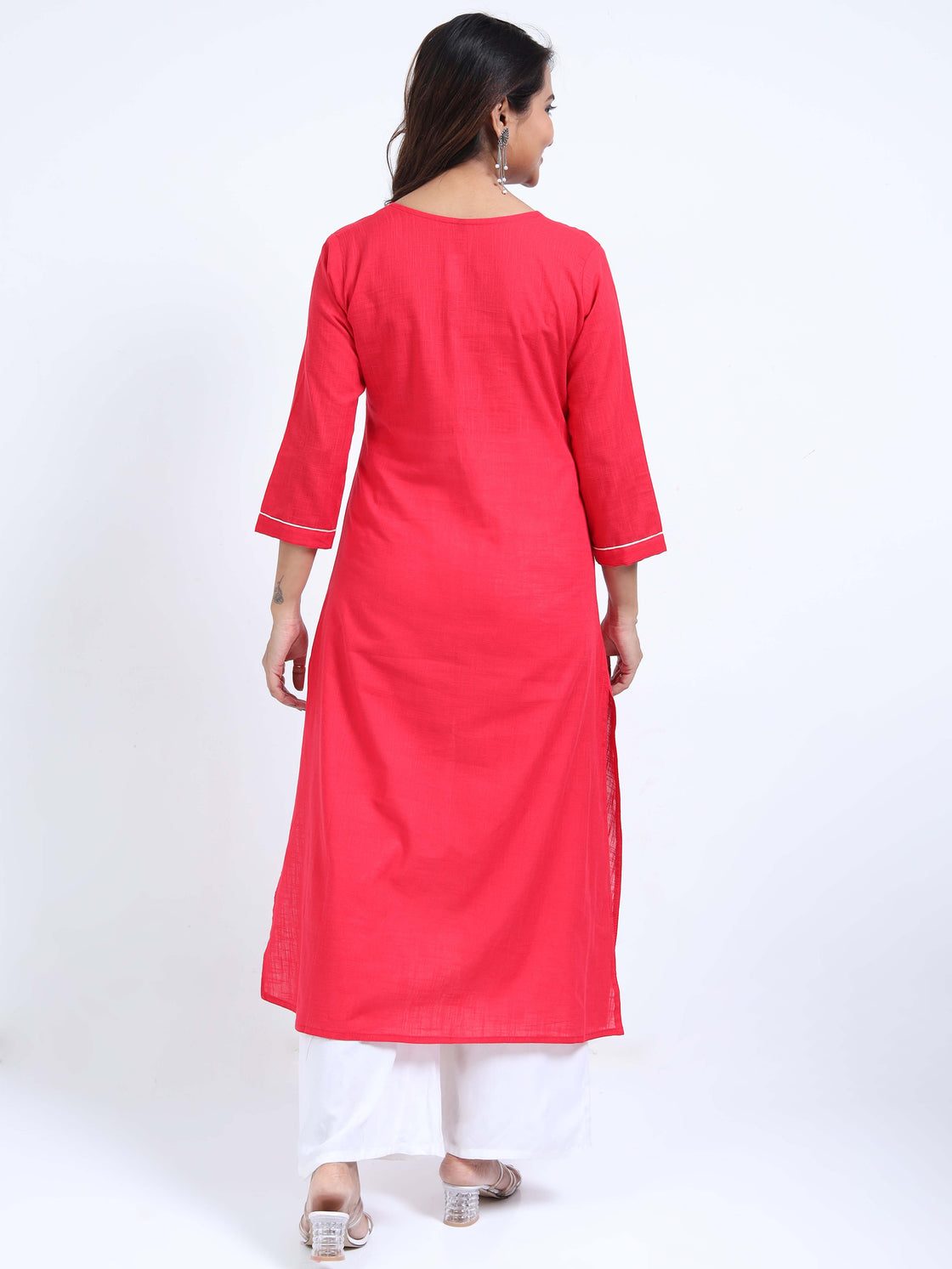 Straight-cut midi kurti with floral embroidery and 3/4 sleeves, paired with palazzos.