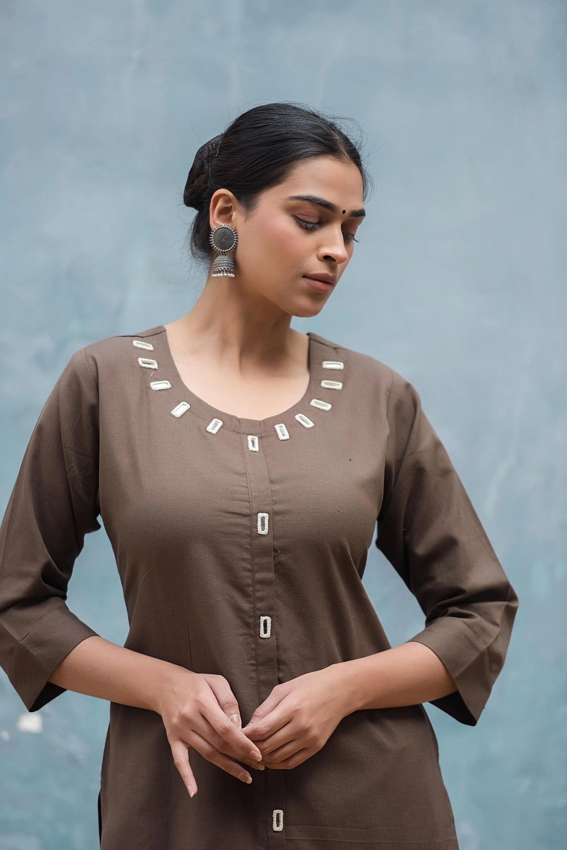 close-up of coffee brown kurti with mirror work for women – classy & comfortable women's wear for work & travel.