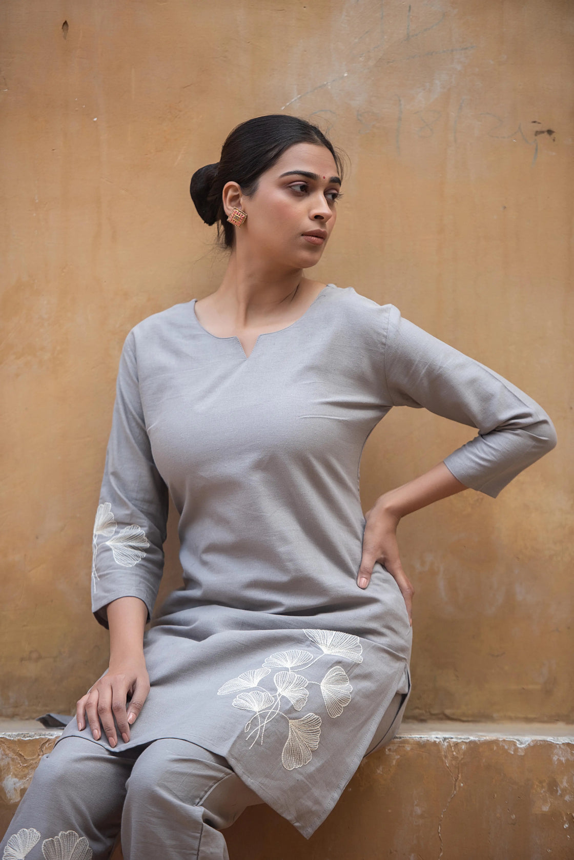 Close-up of floral embroidery on a grey flex cotton co-ord set.